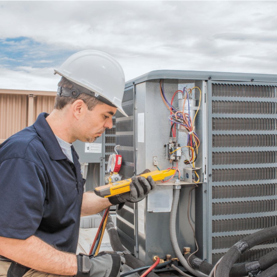 Brantford Heating & Cooling HVAC technician servicing a system