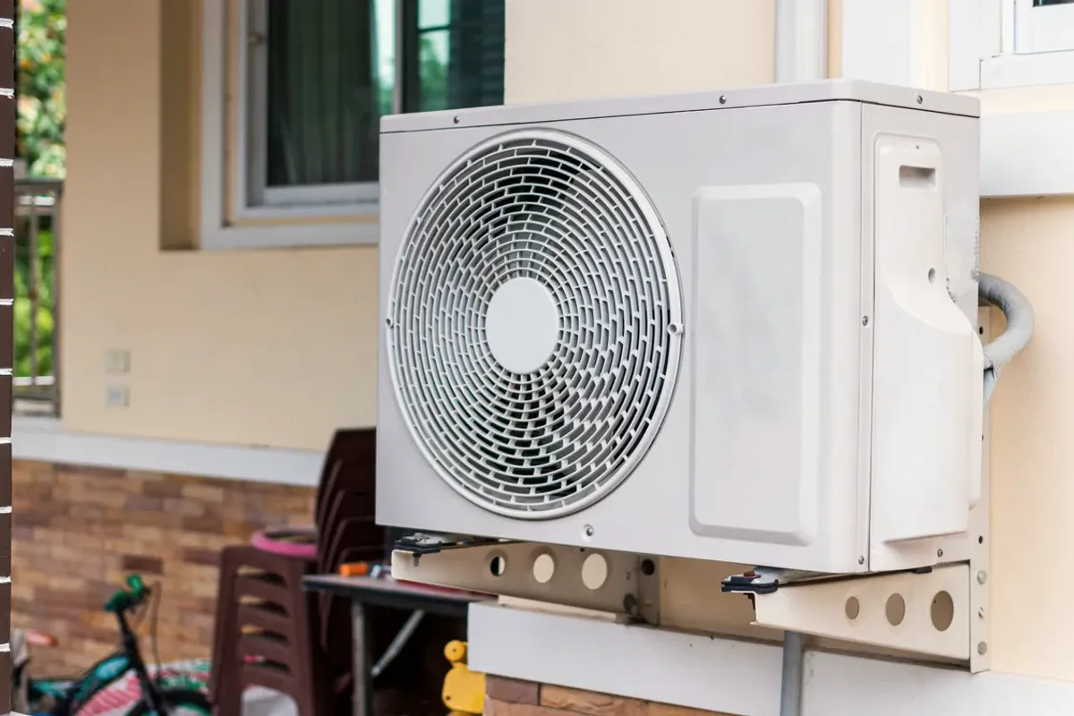Outdoor heat pump unit on a wall bracket